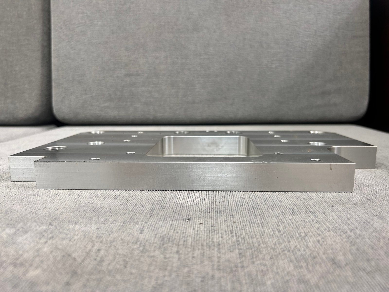 Side view showing plate thickness and the central opening
