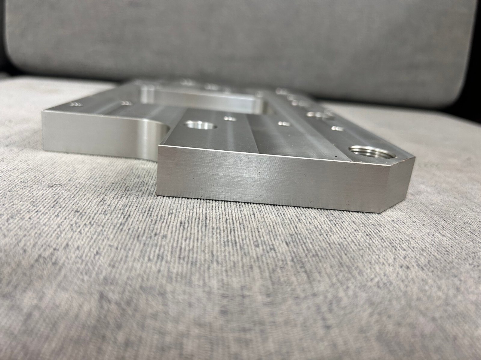Oblique view showing a threaded hole and the machined outer profile